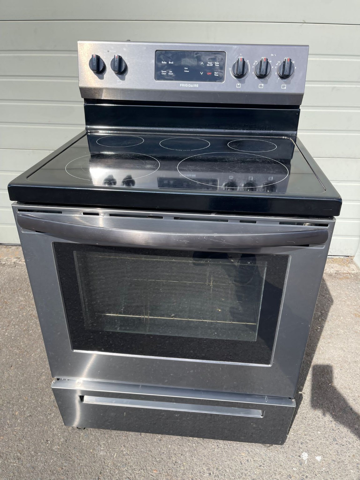 Smooth glass-top electric stove available for stove and range pickup request review